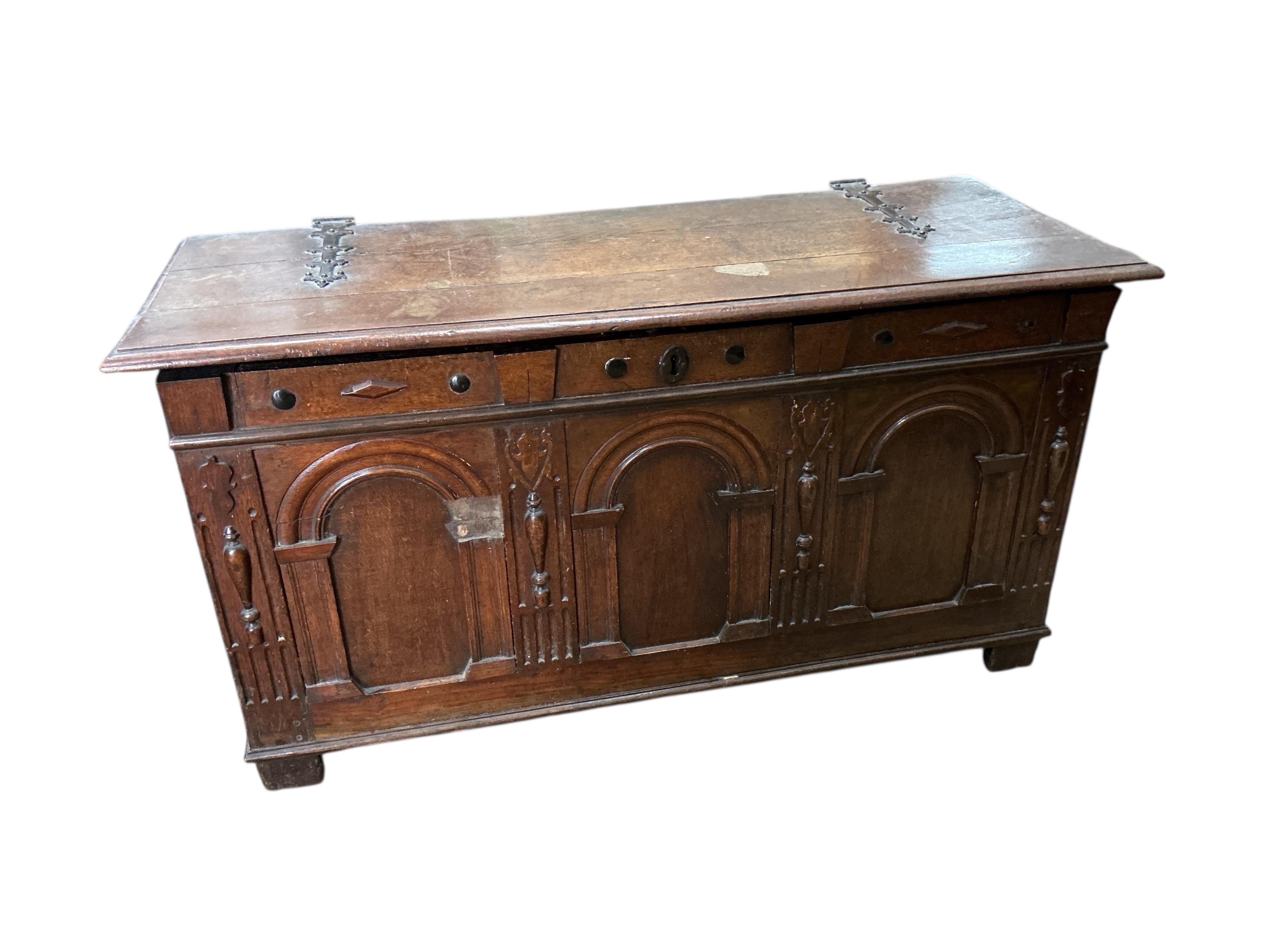 An 18th century oak coffer, width 129cm, depth 53cm, height 66cm